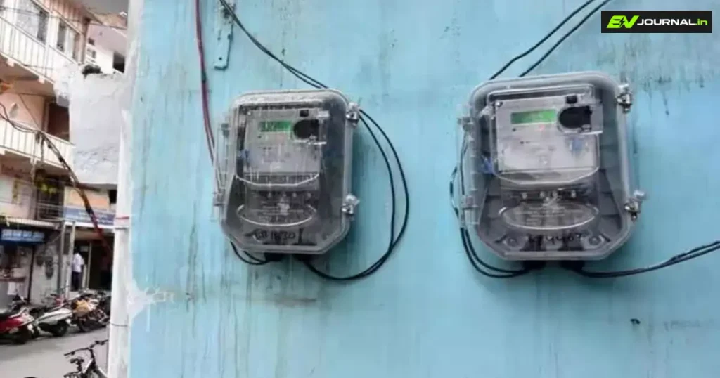 Two electricity meters mounted on a residential building wall for power consumption monitoring